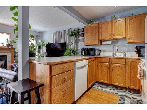 211 Millview Green Sw, Calgary, AB - Indoor Photo Showing Kitchen With Double Sink