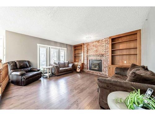 55 Downey Road, Okotoks, AB - Indoor Photo Showing Living Room With Fireplace