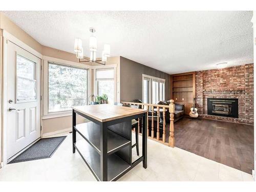 55 Downey Road, Okotoks, AB - Indoor With Fireplace