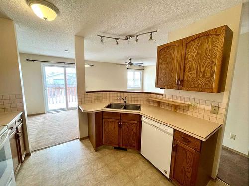 71 Appletree Crescent Se, Calgary, AB - Indoor Photo Showing Kitchen With Double Sink