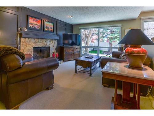 68 Woodfield Road Sw, Calgary, AB - Indoor Photo Showing Living Room With Fireplace