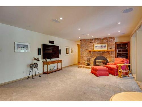 511 Crescent Boulevard Sw, Calgary, AB - Indoor Photo Showing Living Room With Fireplace