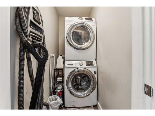 104 Legacy View Se, Calgary, AB - Indoor Photo Showing Laundry Room