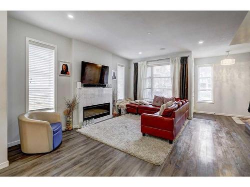 164 Livingston Parade Ne, Calgary, AB - Indoor Photo Showing Living Room With Fireplace