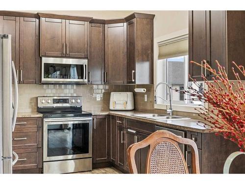 2 Valarosa Court, Didsbury, AB - Indoor Photo Showing Kitchen With Stainless Steel Kitchen With Double Sink