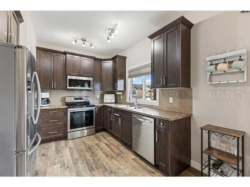 2 Valarosa Court, Didsbury, AB - Indoor Photo Showing Kitchen With Stainless Steel Kitchen With Double Sink With Upgraded Kitchen