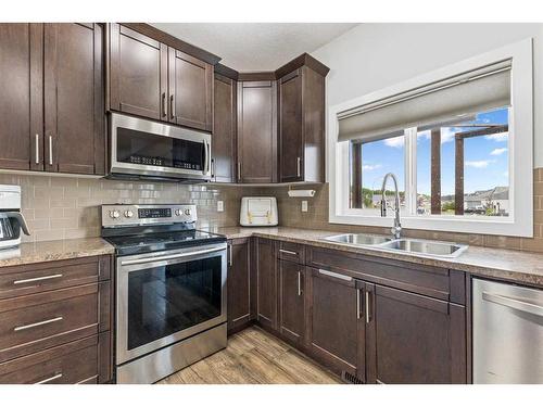 2 Valarosa Court, Didsbury, AB - Indoor Photo Showing Kitchen With Stainless Steel Kitchen With Double Sink