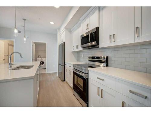 3117-20295 Seton Way Se, Calgary, AB - Indoor Photo Showing Kitchen With Double Sink With Upgraded Kitchen