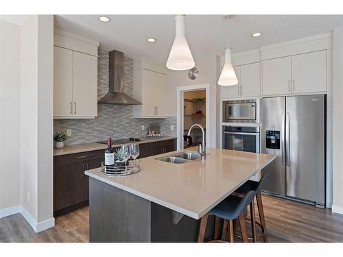57 Sage Bluff Close Nw, Calgary, AB - Indoor Photo Showing Kitchen With Double Sink With Upgraded Kitchen