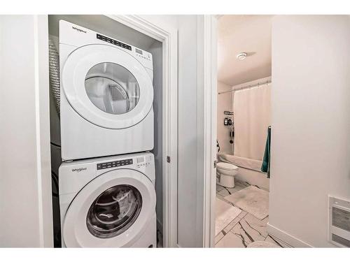 66 Mallard Heath Se, Calgary, AB - Indoor Photo Showing Laundry Room