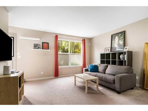 1218-10 Auburn Bay Avenue Se, Calgary, AB - Indoor Photo Showing Living Room