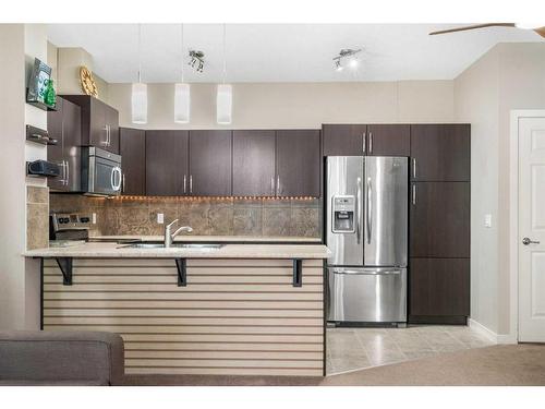 1218-10 Auburn Bay Avenue Se, Calgary, AB - Indoor Photo Showing Kitchen With Stainless Steel Kitchen With Upgraded Kitchen