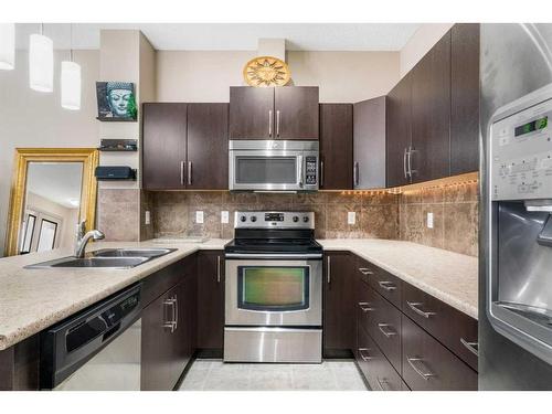 1218-10 Auburn Bay Avenue Se, Calgary, AB - Indoor Photo Showing Kitchen With Stainless Steel Kitchen With Double Sink With Upgraded Kitchen