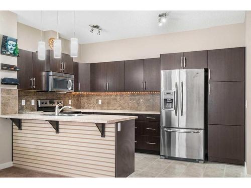 1218-10 Auburn Bay Avenue Se, Calgary, AB - Indoor Photo Showing Kitchen With Stainless Steel Kitchen With Upgraded Kitchen