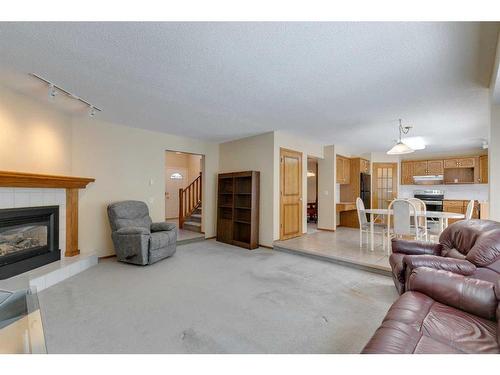 252 Edgebrook Gardens Nw, Calgary, AB - Indoor Photo Showing Living Room With Fireplace