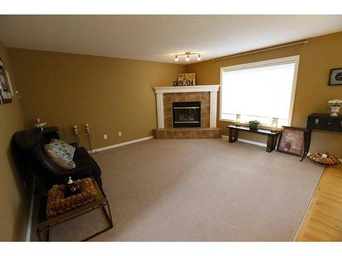 132 Evergreen Heights Sw, Calgary, AB - Indoor Photo Showing Living Room With Fireplace