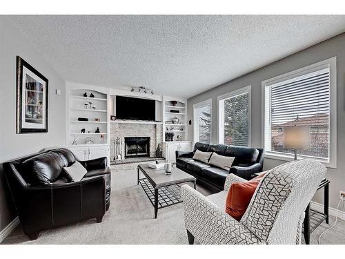 136 Hawkdale Close Nw, Calgary, AB - Indoor Photo Showing Living Room With Fireplace