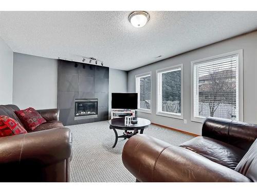 136 Hawkdale Close Nw, Calgary, AB - Indoor Photo Showing Living Room With Fireplace