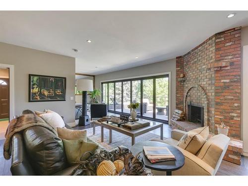 626 Riverdale Avenue Sw, Calgary, AB - Indoor Photo Showing Living Room With Fireplace