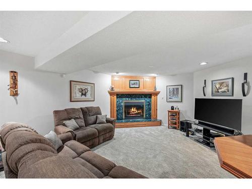 7319 37 Avenue Nw, Calgary, AB - Indoor Photo Showing Living Room With Fireplace
