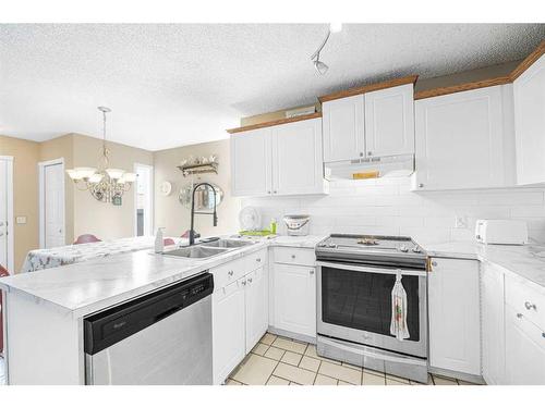 284 Mt Aberdeen Close Se, Calgary, AB - Indoor Photo Showing Kitchen With Double Sink