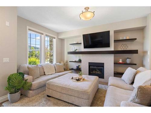 428 Quarry Park Boulevard Se, Calgary, AB - Indoor Photo Showing Living Room With Fireplace