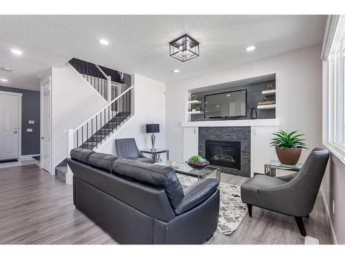 4231 63 Avenue, Innisfail, AB - Indoor Photo Showing Living Room With Fireplace