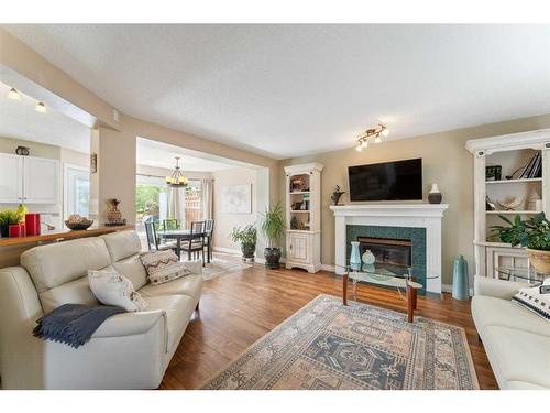 15 Somerside Common Sw, Calgary, AB - Indoor Photo Showing Living Room With Fireplace