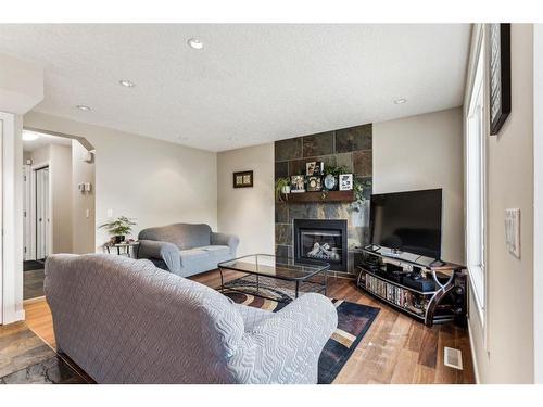 17 Applemont Place Se, Calgary, AB - Indoor Photo Showing Living Room With Fireplace