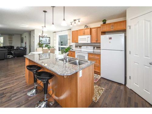 245 Silverado Way Sw, Calgary, AB - Indoor Photo Showing Kitchen With Double Sink