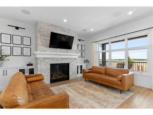 22 Coutts Close, Olds, AB - Indoor Photo Showing Living Room With Fireplace