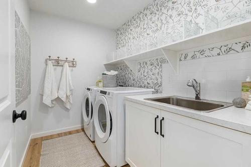 34 Walcrest Row Se, Calgary, AB - Indoor Photo Showing Laundry Room