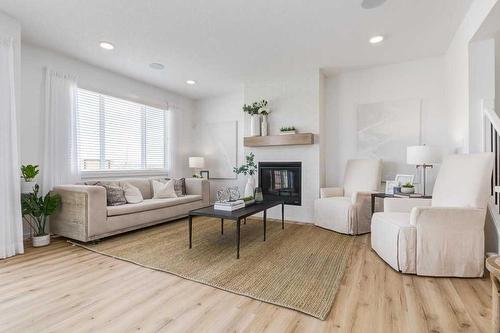 34 Walcrest Row Se, Calgary, AB - Indoor Photo Showing Living Room With Fireplace