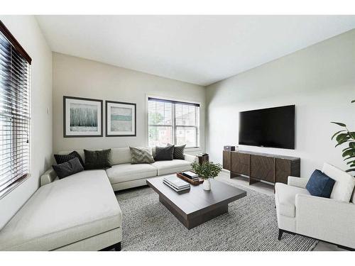 200-1414 17 Street Se, Calgary, AB - Indoor Photo Showing Living Room