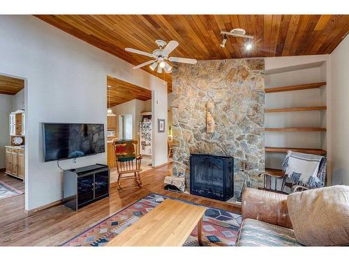 66 Wolf Drive, Rural Rocky View County, AB - Indoor Photo Showing Living Room With Fireplace