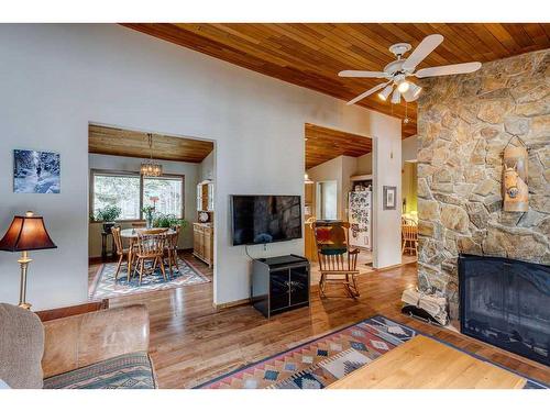 66 Wolf Drive, Rural Rocky View County, AB - Indoor Photo Showing Living Room With Fireplace