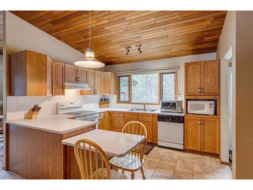 66 Wolf Drive, Rural Rocky View County, AB - Indoor Photo Showing Kitchen With Double Sink