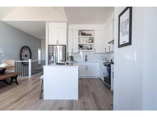 110 Wolf Crescent, Okotoks, AB - Indoor Photo Showing Kitchen With Upgraded Kitchen