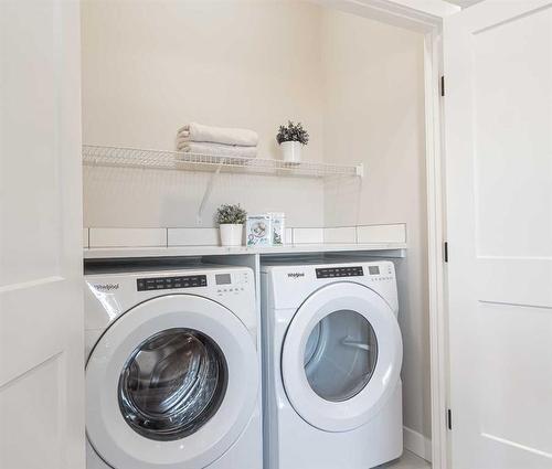 110 Wolf Crescent, Okotoks, AB - Indoor Photo Showing Laundry Room