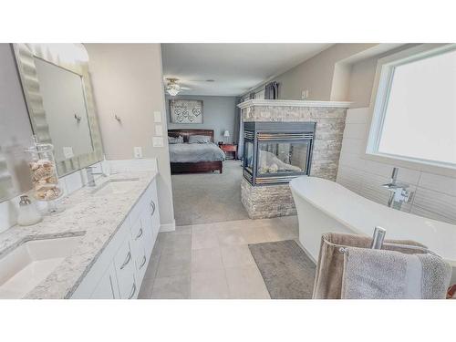 86 Langford Crescent, Red Deer, AB - Indoor Photo Showing Bathroom With Fireplace