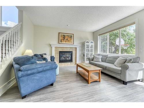 48 Prestwick Estate Way Se, Calgary, AB - Indoor Photo Showing Living Room With Fireplace