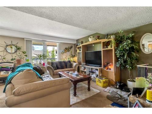 206-2200 Woodview Drive Sw, Calgary, AB - Indoor Photo Showing Living Room