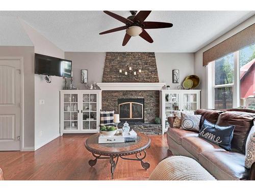 363 Cranleigh View Se, Calgary, AB - Indoor Photo Showing Living Room With Fireplace