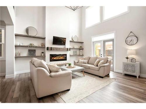 60 Auburn Shores Se, Calgary, AB - Indoor Photo Showing Living Room With Fireplace