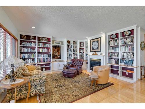 132 Patterson Drive Sw, Calgary, AB - Indoor With Fireplace