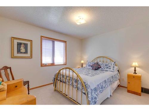 132 Patterson Drive Sw, Calgary, AB - Indoor Photo Showing Bedroom