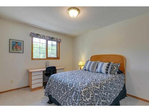 132 Patterson Drive Sw, Calgary, AB - Indoor Photo Showing Bedroom