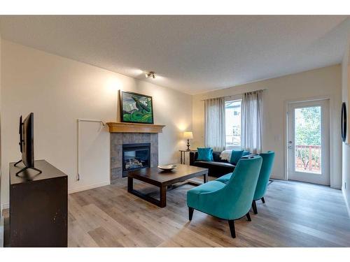 49 Everglen Crescent Sw, Calgary, AB - Indoor Photo Showing Living Room With Fireplace