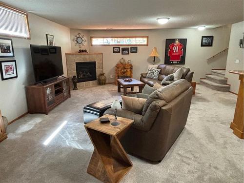 85 Manyhorses Drive, Rural Rocky View County, AB - Indoor Photo Showing Other Room With Fireplace