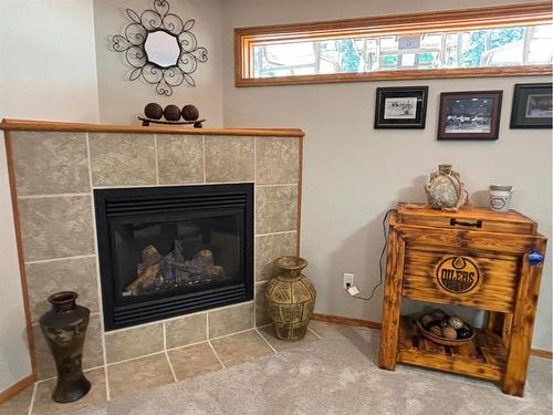 85 Manyhorses Drive, Rural Rocky View County, AB - Indoor Photo Showing Living Room With Fireplace